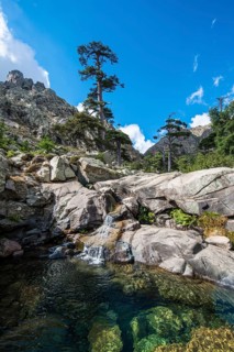 Pool and small waterfall in the mountains