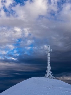 Summit cross covered with hoarfrost