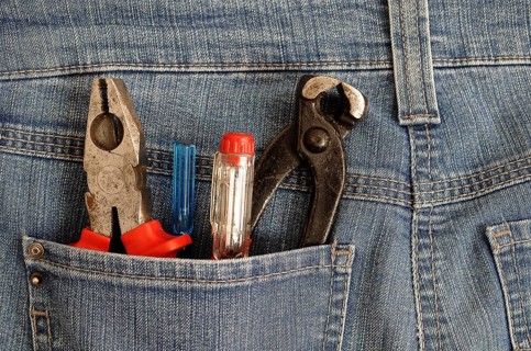 Pliers and screwdrivers in a back pocket