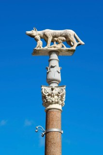 Pillar of the she-wolf with Romulus and Remus in front of the Duomo of Siena