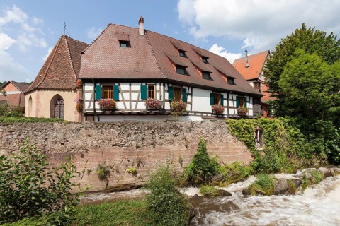 Oberhof Chapel and half-timbered houses on the river Weiss