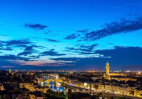 Illuminated city panorama at dusk with Florence Cathedral