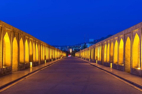 Illuminated Si-o-se Pol Bridge or Allah-Verdi Khan Bridge at dusk
