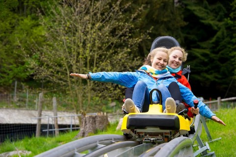 Young women on a summer toboggan run