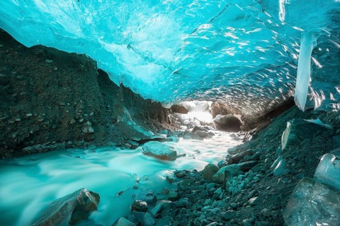 Glacier cave with a stream