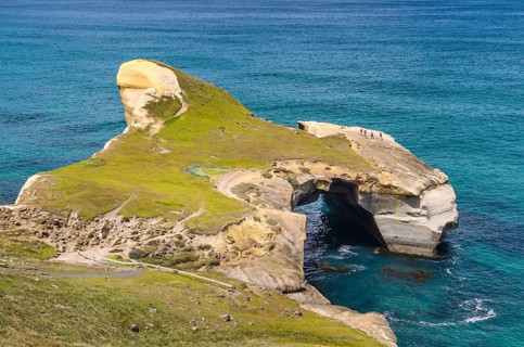 Rocky cliffs on the Pacific coast at Tunnel Beach