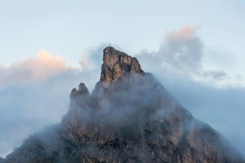 Mount Sass de Stria in the clouds at sunrise