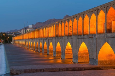 Illuminated Si-o-se Pol Bridge or Allah-Verdi Khan Bridge at dusk
