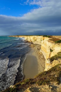 Cliffs in the evening light with rain clouds