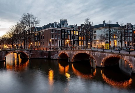 Canal with bridge at dusk