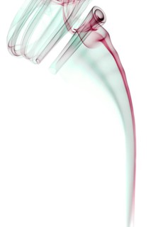 Colourful smoke from an incense stick or joss stick