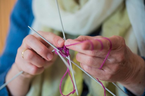 Hands of a senior knitting