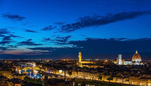 Illuminated city panorama at dusk with Florence Cathedral