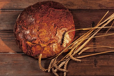 Freshly baked farmhouse bread with wheat ears