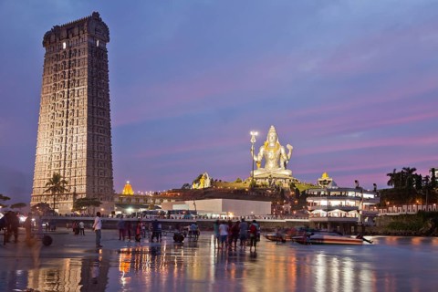 Giant statue of Lord Shiva and a Gopura tower