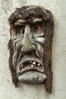 Wooden mask hanging on a wall