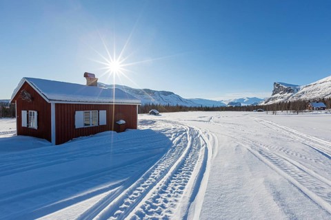 Wooden huts STF Aktse Fjallstuga in winter