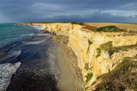 Cliffs in the evening light with rain clouds