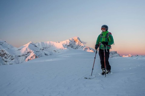 Ski tourer on the summit of Mt Col de Lasta in the Fanes-Sennes-Prags Nature Park in the Dolomites