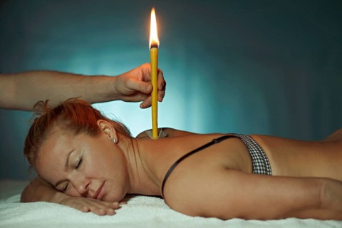 Woman being treated with a body candle