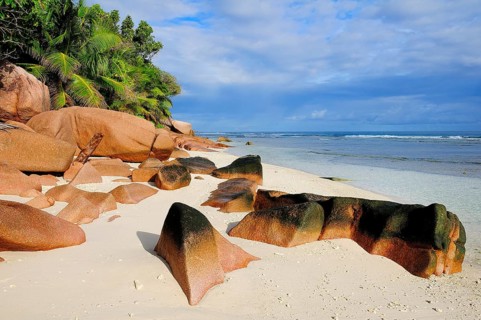 Granite rocks on the sandy beach beach
