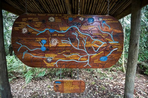 Wooden sign depicting hiking trails of the Central Circuit