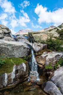 Pool with a small waterfall in the mountains
