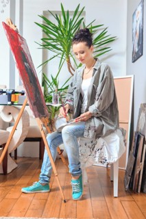 Portrait of a female painter at work