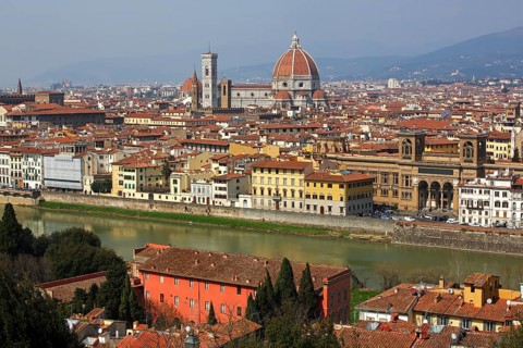 Panoramic view over the river Arno towards the historic centre