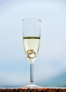 Wedding rings in a champagne glass