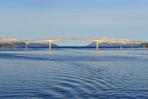 Sortland Bridge over wavy blue waters of Sortlandssundet strait