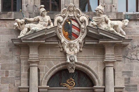 Right portal of the west facade with imperial coat of arms and the many-headed
