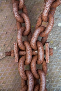 Rusty large metal chain and bolt