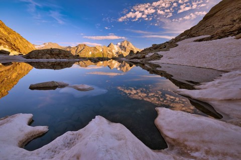 Reflection of the Oberalpstock in a mountain lake