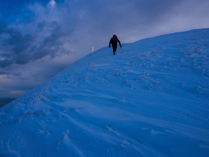 Hiker in snow on Monte Catria