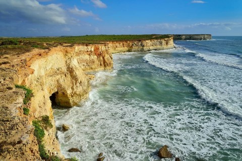 Cliffs with caves