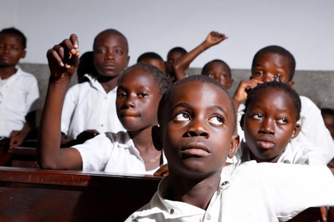 School children in school uniform during class