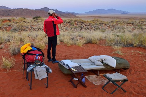 Tourist standing in an open air campsite at Schafberg Camp on Tok Tokkie Trail