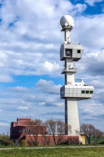 Knock Lighthouse with the radar and radio tower of the Ems traffic control centre