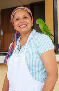 Woman with a parrot on her shoulder