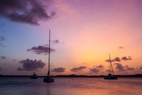 Sunset and sailboats in the Nonsuch Bay