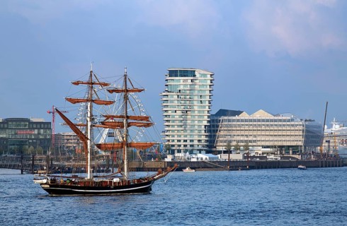 Historic sailing ship in front of esidential Marco Polo Tower and Unilever-Haus office building