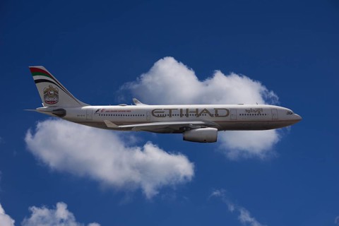 A6-EYK Etihad Airways Airbus A330-243 in flight against a cloudy sky