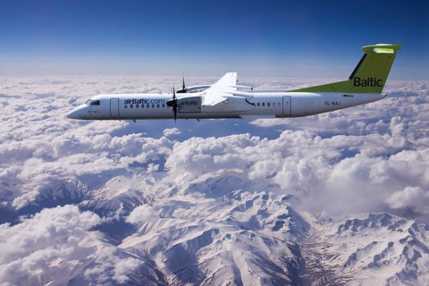 Aircraft YL-BAJ Air Baltic De Havilland Dash 8 in flight above the Alps