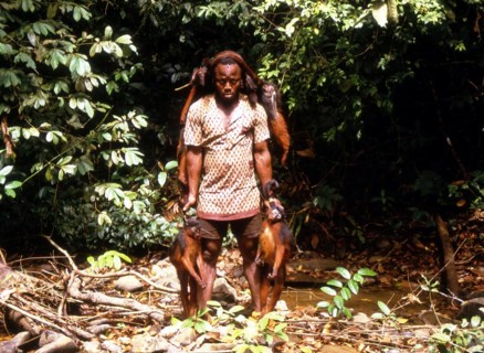 Poacher returning from the hunt with hunted prey