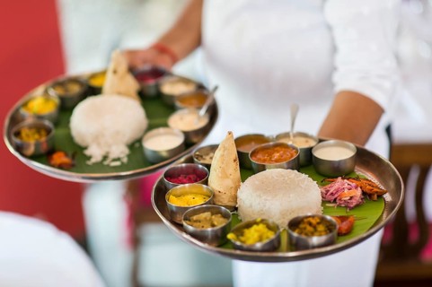 Chef with two South Indian Thalis