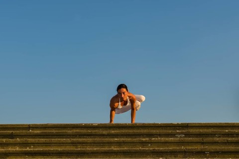 Young woman practising Hatha yoga