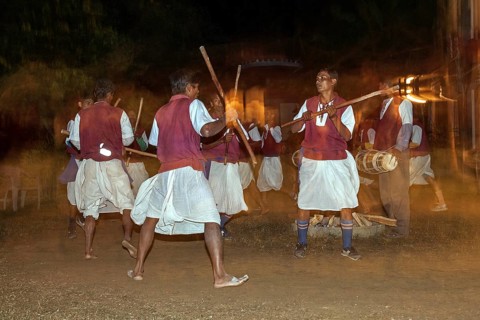 Nepalese men perform a traditional dance