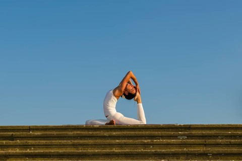 Young woman practising Hatha yoga