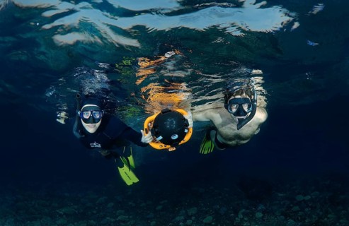 Freediver with an underwater scooter